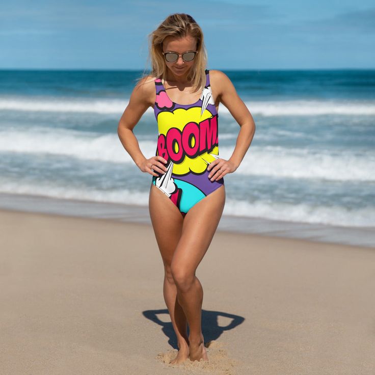 Pop Art One-Piece Swimsuit Fun Graphic Print Swimwear For Beach, Fun Graphic Print Swimwear For The Beach, Multicolor Graphic Print Swimwear For Pool, Beachwear Swimwear With Graphic Print For Poolside, Graphic Print Swimwear For Pool And Beach Season, Graphic Print Beachwear Swimwear, Graphic Print Swimwear For Surfing, Surfing Swimwear With Graphic Print For Beach Season, Graphic Print Swimwear For Surfing In Summer