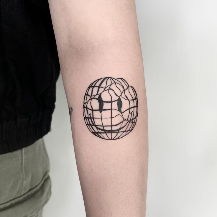 a person with a black and white tattoo on their arm