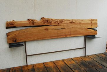 a wooden bench sitting on top of a wooden floor