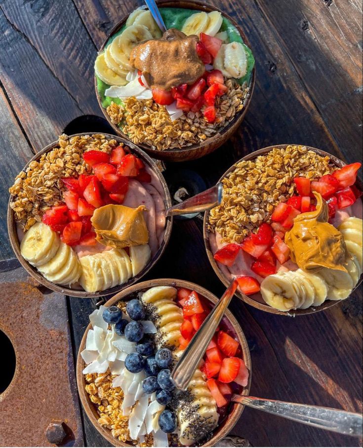 four bowls filled with different types of food