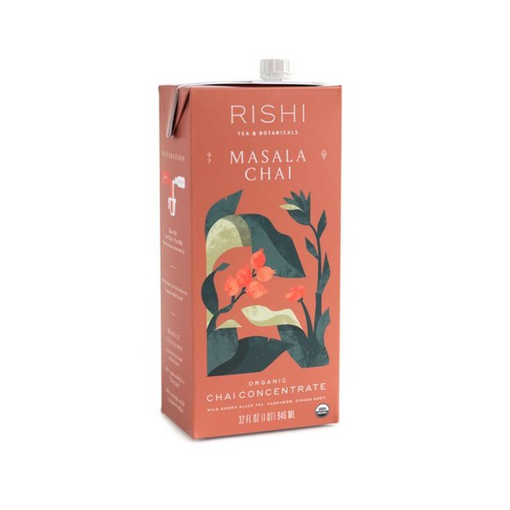 a carton of masala chai tea on a white background with an orange flower