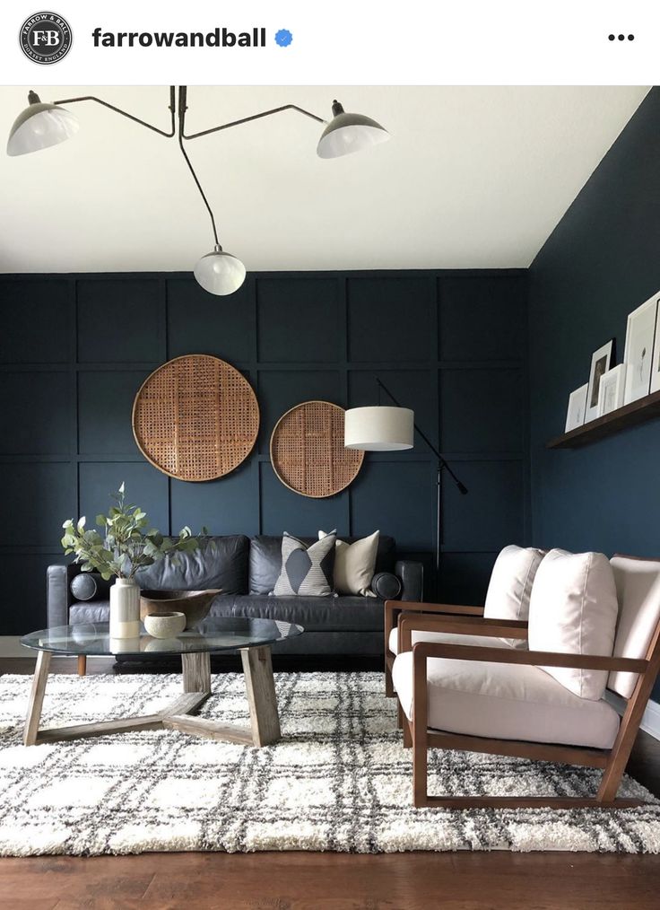 a living room with blue walls and furniture