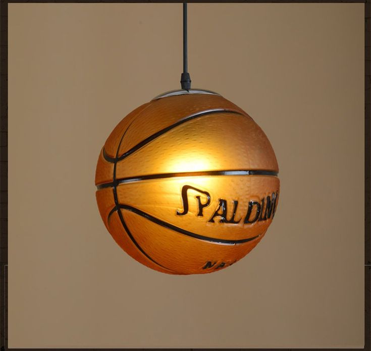 a basketball hanging from a ceiling in a room