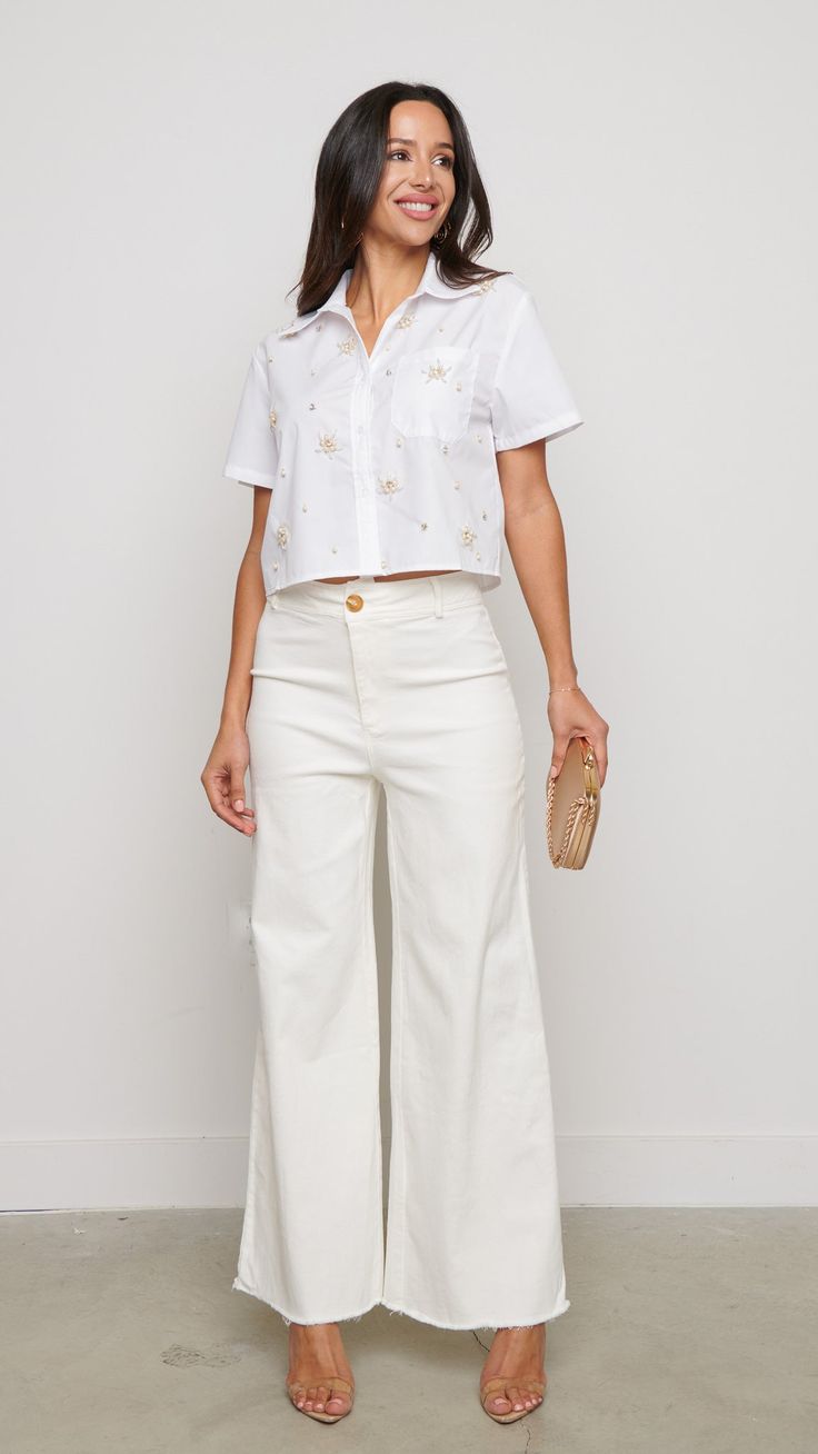 Elevate your casual look with these white wide leg pants. The sleek white hue adds versatility, allowing for easy pairing with both casual tees or dressier tops for a chic ensemble. With their smooth satin finish, these pants offer a perfect balance of style and practicality for any occasion. Features: White Wide Leg Pants 81544 P2-2-2 White Cotton Wide Leg Pants For Summer, White Relaxed Fit Wide Leg Pants For Work, White Cotton Wide Leg Pants For Day Out, White Wide Leg Pants With Pockets For Spring, Versatile White Pants For Spring, Chic White Ankle-length Wide Leg Pants, White Wide Leg Summer Pants With Pockets, Chic White Wide Leg Pants With Pockets, White Cropped Bottoms For Summer