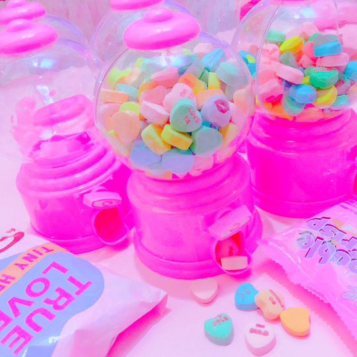 candy dispensers are sitting on a table