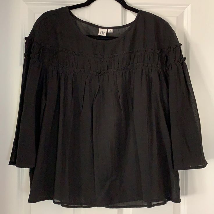 Black Cotton Gauze Flowy Top With Ruffled Detail And 3/4 Sleeves. Never Worn Perfect Condition Casual Black Half Sleeve Blouse, Black Summer Blouse With 3/4 Sleeves, Black Relaxed Fit Blouse With 3/4 Sleeve, Black 3/4 Sleeve Summer Blouse, Black Cotton Half Sleeve Blouse, Black Gap Top For Summer, Black Half Sleeve Cotton Blouse, Gap Black Summer Top, Black Cotton Gap Tops