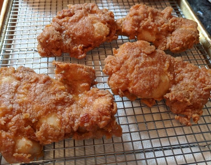 four fried food items on a cooling rack