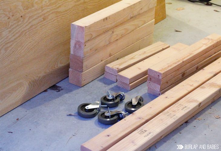 several pieces of wood sitting on the floor next to some clamps and screws