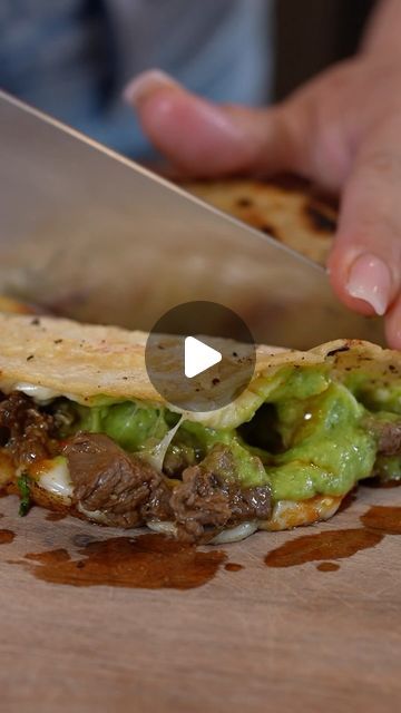 a person cutting up food with a knife