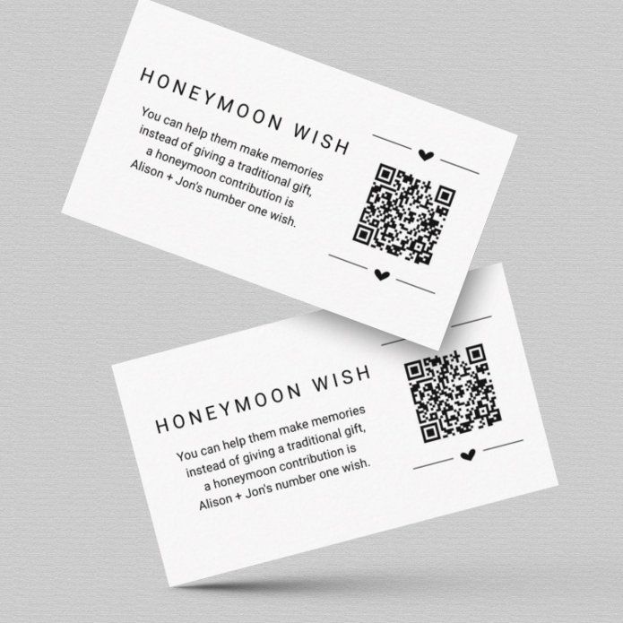 two white business cards with qr code on the front and one in the back