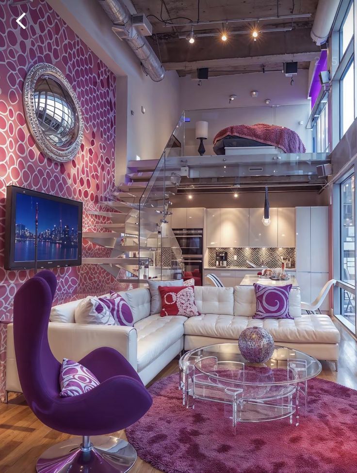 a living room filled with furniture and a spiral staircase