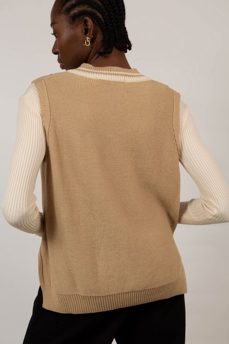 Nail the preppy look with our beige and ivory varsity sweater vest. This cable-knit vest is made of acrylic, a warm vegan-friendly alternative to wool that’s easy to care for. The V-neck and neutral beige tones make this knitted vest a great everyday piece to wear over dresses, blouses or turtleneck tops. - Beige and ivory varsity vest - Cable-knit - Vegan-friendly knitwear Cable Knit Vest, Argyle Sweater Vest, Varsity Sweater, Black Herringbone, Fitted Jumper, Beige Tones, London Free, Turtle Neck Jumper, Knitted Vest