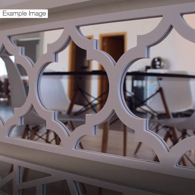 the reflection of a table and chairs in a mirror