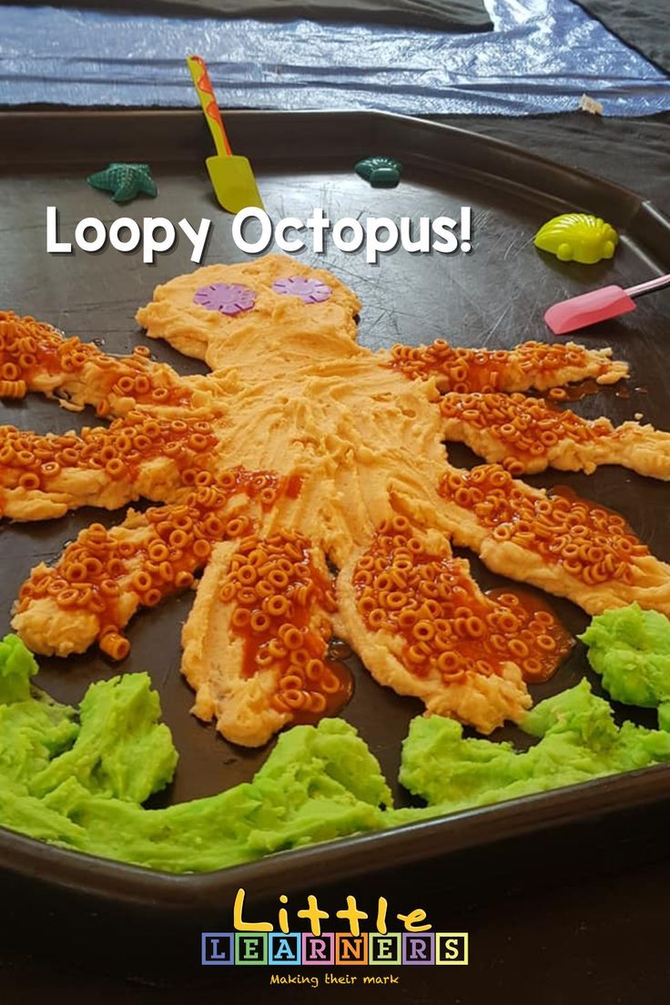 an octopus made out of noodles and lettuce on a tray with the caption loopy octopus