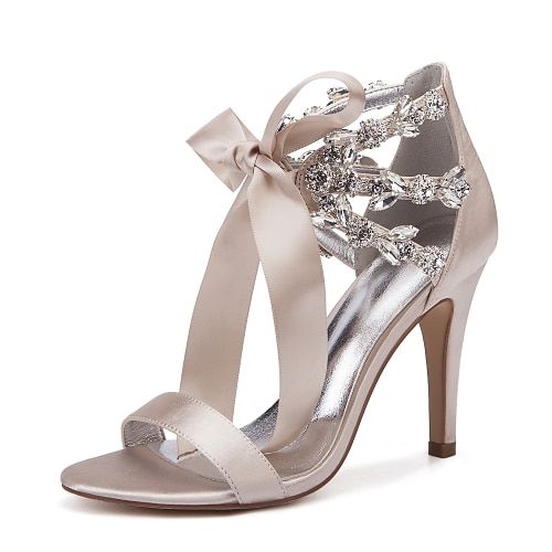 a women's high heeled sandal with a bow