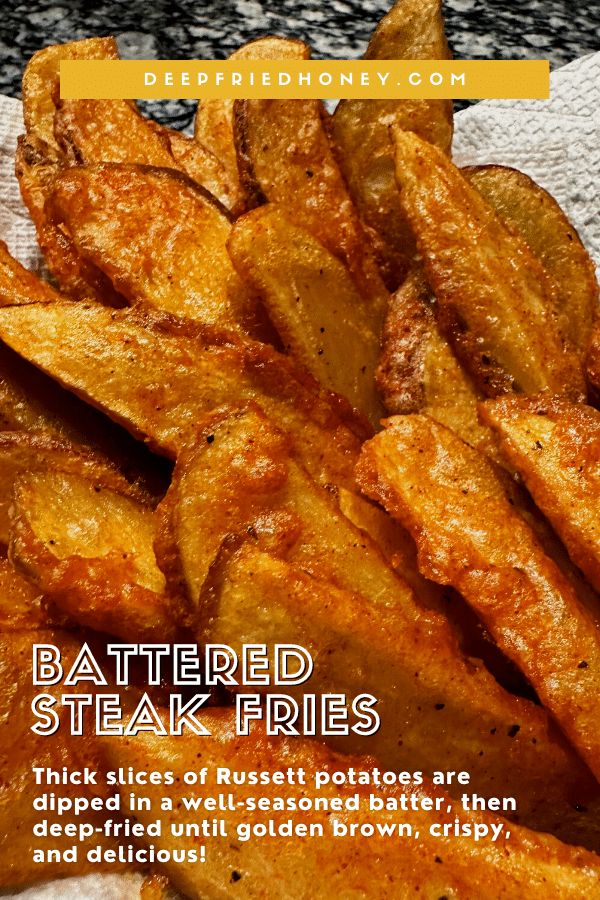 a close up of some fried food on a towel with text over it that reads, battered steak fries thick slices of rustet potatoes are dipped in a well seasoned batter