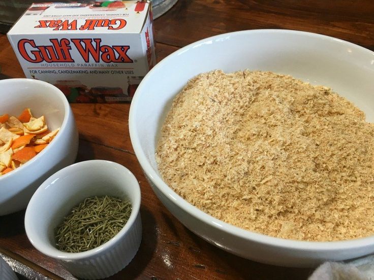 two bowls filled with food next to a carton of gluffwax