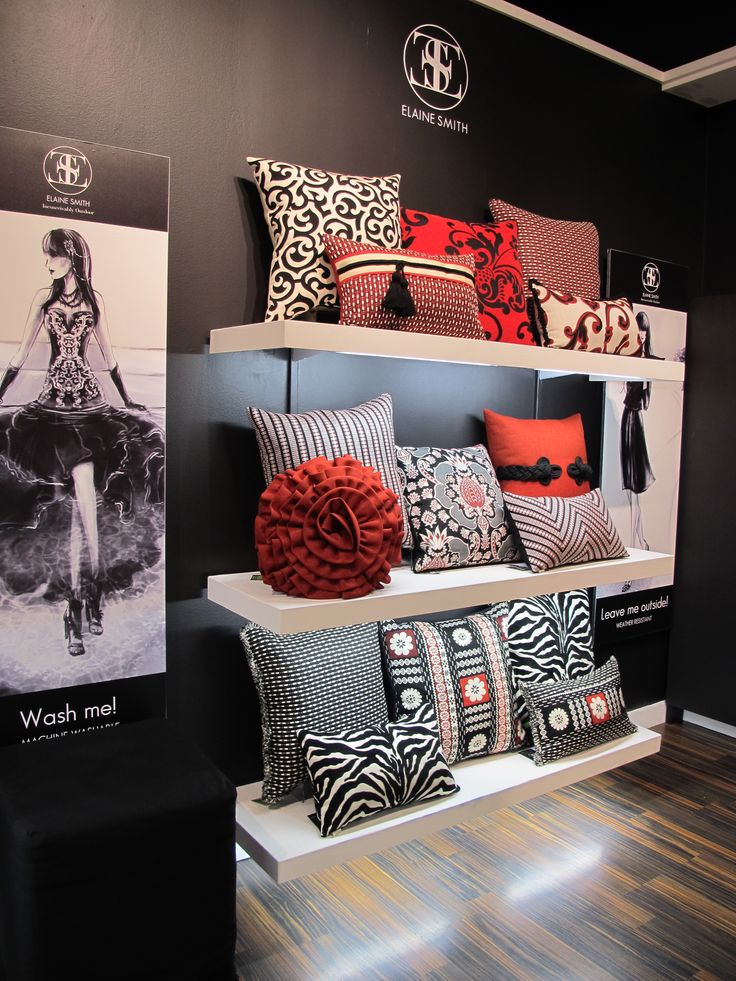 a display in a store filled with lots of different colored pillows and decorative throw pillows