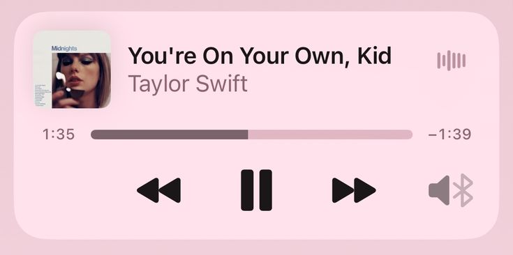 a pink play button with the text you're on your own, kid taylor swift