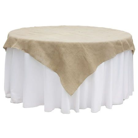 a round table with a white skirt and tan linen over it on a white background