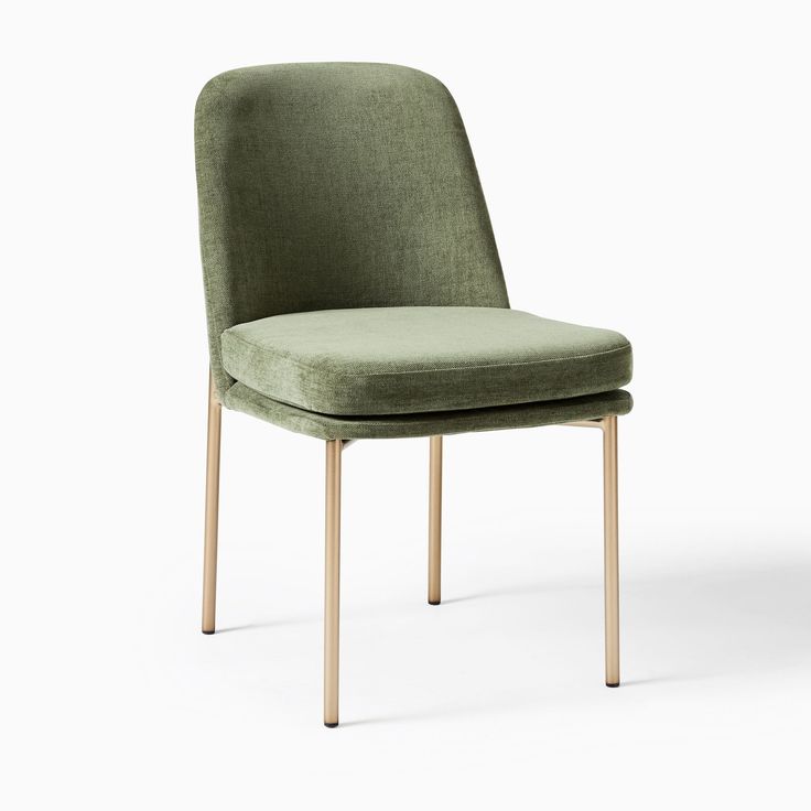 an upholstered green chair with wooden legs and back rests against a white background