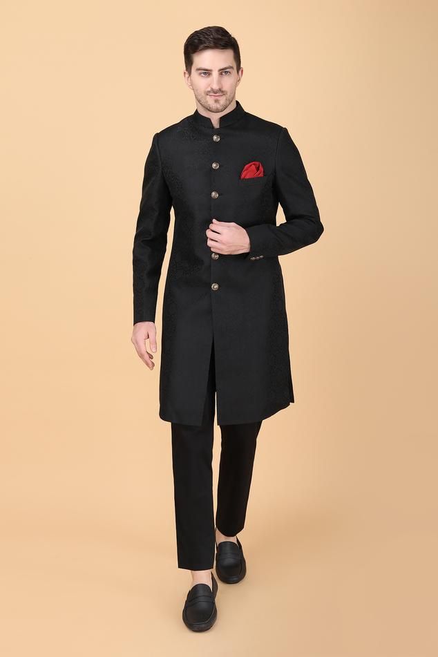 Black floral brocade pattern sherwani. Paired with pant. Comes along with a pocket square.
Components: 3
Pattern: Brocade
Type Of Work: Floral
Neckline: Stand Collar
Sleeve Type: Full Sleeves
Fabric:  Sherwani: Art Silk Brocade, Pant: Suitings
Color: Black
Other Details: 
Closure: Front buttons
Occasion: Destination Wedding,Groom - Aza Fashions Black Sherwani, Brocade Pattern, Rohit Bal, Tarun Tahiliani, Silk Brocade, Manish, Sherwani, Full Sleeves, Wedding Groom