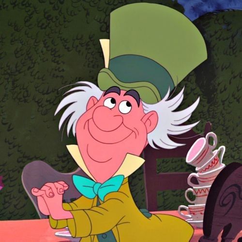 an animated character sitting at a table in front of a teapot and coffee cup