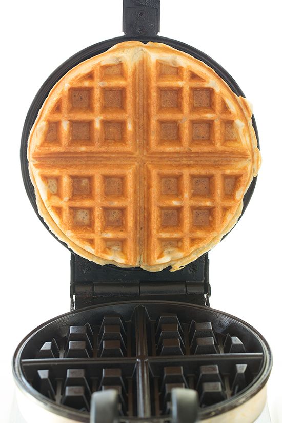 a waffle maker is shown with the top half cut off and ready to be cooked