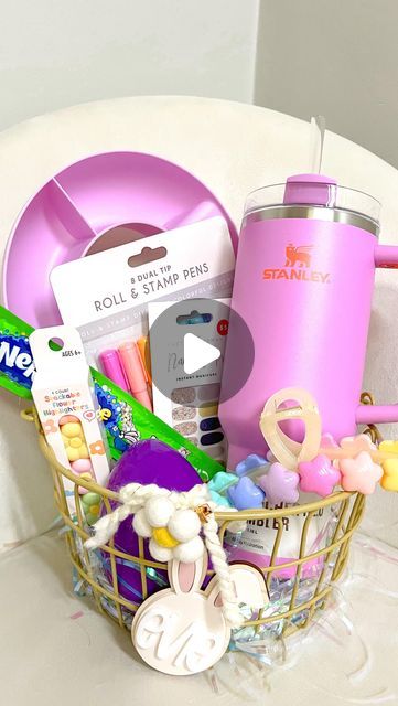 a basket filled with lots of items on top of a table next to a cup