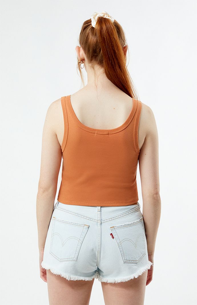 Keep things simple with Billabong's Sun Goddess Tank Top. This classic cropped tank has fixed straps, a scoop neckline, and a a Billabong label at the hem. 


	Solid color tank top
	Scoop neckline
	Fixed straps
	Cropped length
	Billabong label
	100% cotton
	Machine washable
	Model is wearing a size small
	Model measurements: 5’8” height, 30.5” bust, 24.5” waist, 35.5” hips Slim Fit Cargo Pants, Sun Goddess, Curve Jeans, Dad Jeans, Jeans Kids, Kids Swimwear, Slim Fit Pants, Going Out Dresses, Man Swimming