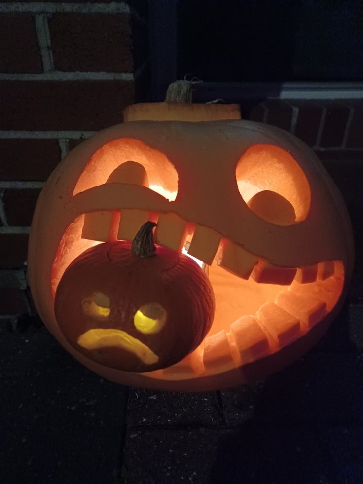 a carved pumpkin with an angry face on it