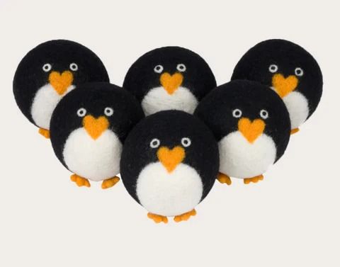 four black and white penguins with orange beaks are shown in front of a white background