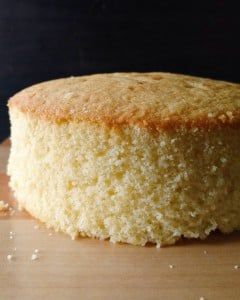 a round cake sitting on top of a wooden table