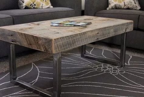 a coffee table made out of wood with metal legs and an iron frame on top