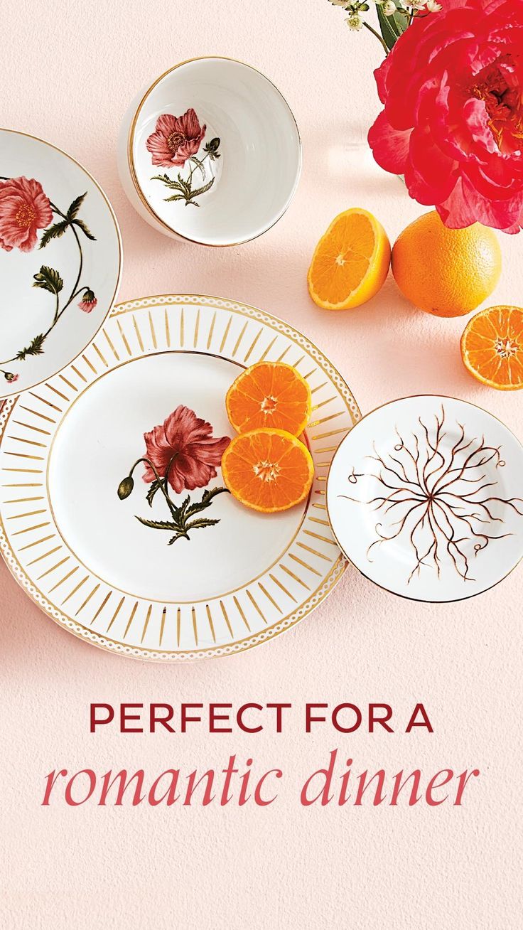 there are plates with flowers and oranges on them, along with the words perfect for a romantic dinner