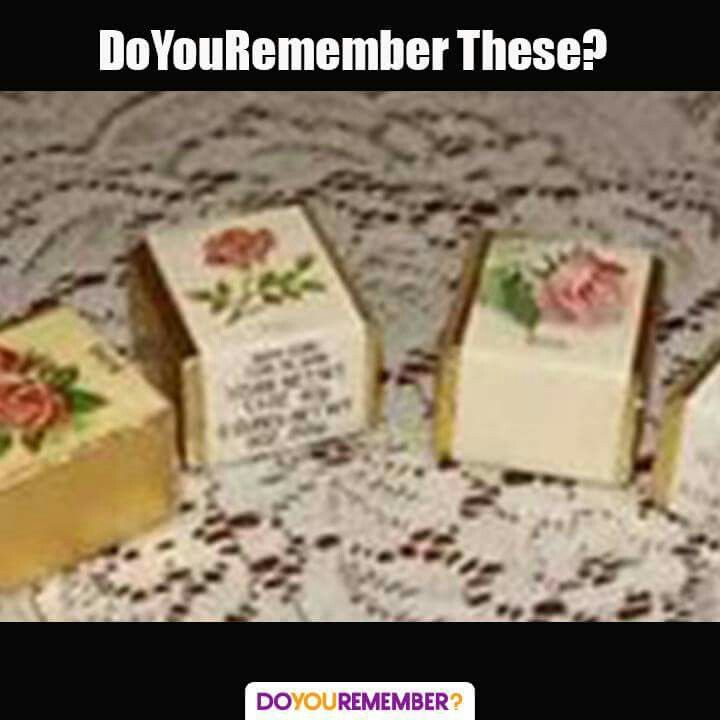 three small pieces of cake sitting on top of a doily covered table with roses