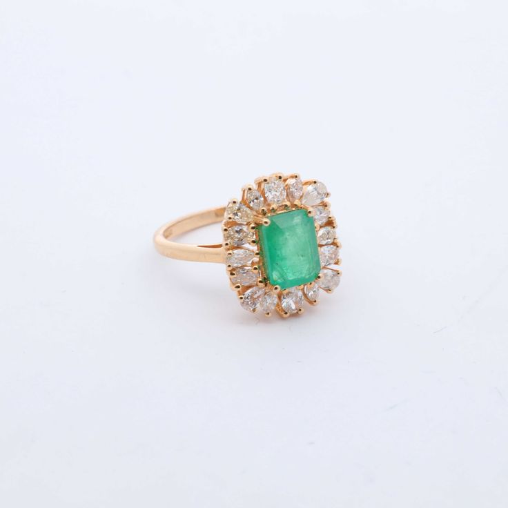 Indulge in luxury with our exquisite Emerald and Diamond Cocktail Ring. Adorned with stunning emeralds and diamonds, this ring exudes sophistication and elegance. Elevate any outfit with this timeless piece, perfect for any occasion. Feel like a true icon when you wear our Emerald & Diamond Cocktail Ring. 14k Yellow Gold 1.75CTW Natural Emerald Natural Diamonds: .80CTW Round Diamonds Luxury Emerald Cluster Ring With Halo Setting, Luxury Cluster Emerald Ring With Halo Setting, Luxury Cluster Emerald Ring, Luxury Yellow Gold Cluster Emerald Ring, Luxury Cluster Emerald Ring In Yellow Gold, Green Cluster Luxury Ring, Luxury Cluster Emerald Ring With Diamonds, Luxury Emerald Cut Emerald Cluster Ring, Luxury Green Cluster Ring With Center Stone