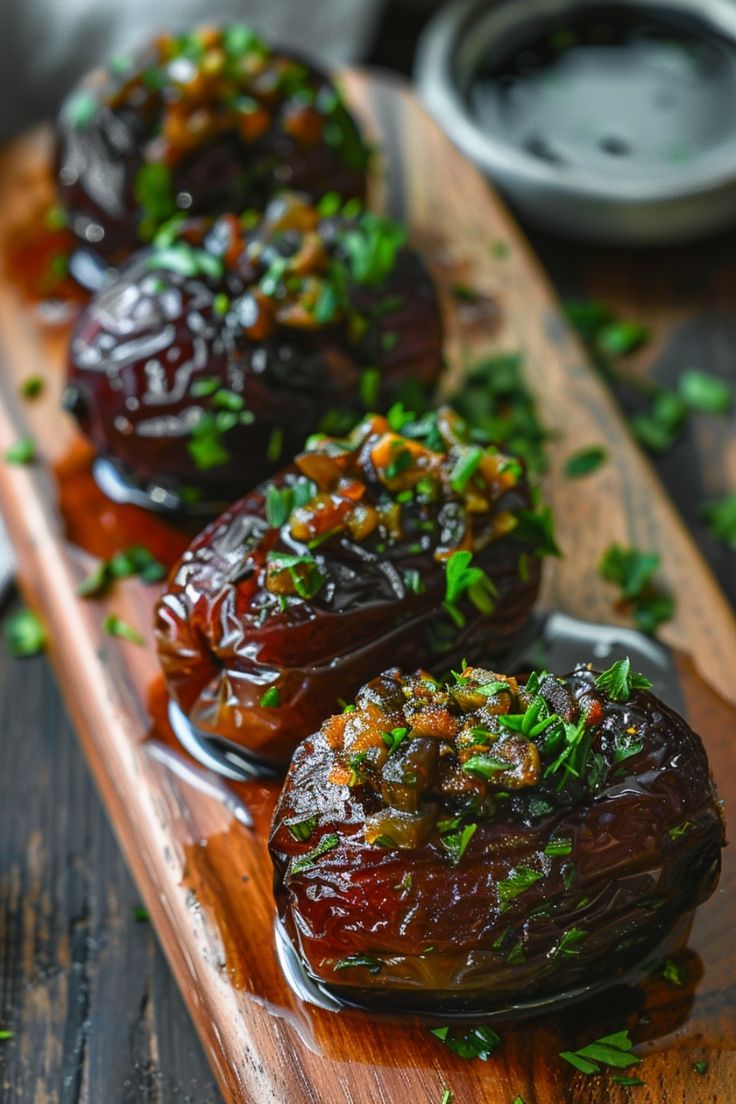 Stuffed dates garnished with fresh herbs on a wooden platter. Easy Amuse Bouche Ideas, Book Club Snacks Easy, Dates Food Ideas, Whipped Feta Stuffed Dates, Halloween Savory Appetizers, Whimsical Appetizers, Savory Stuffed Dates, Endive Appetizers Boats, Savory Date Recipes