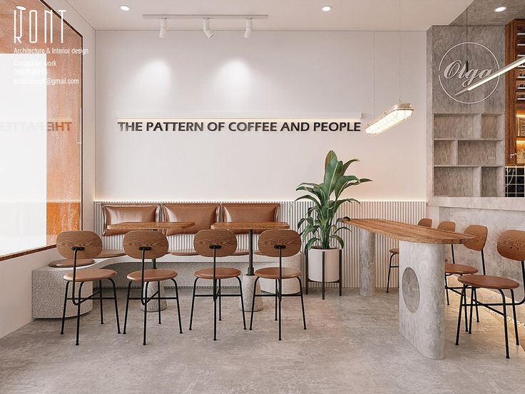 the interior of a coffee and people shop with tables, chairs, and planters