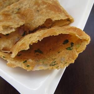 two fried food items on a white plate