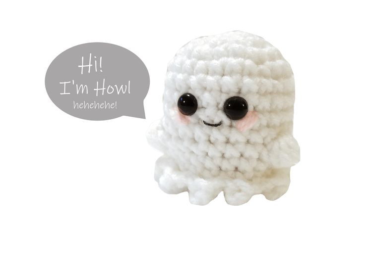 a white crocheted toy with black eyes and a speech bubble above it that says i'm hotel