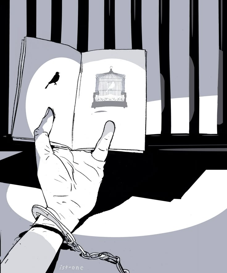 a hand holding an open book with a birdcage in the cage behind it