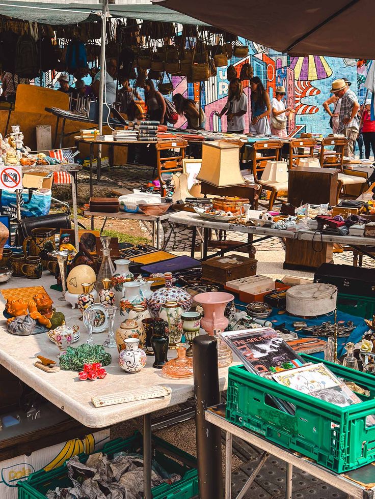 an outdoor flea market with lots of items for sale