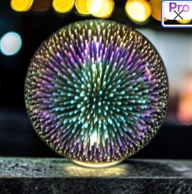 a circular object sitting on top of a wooden table next to a blurry background