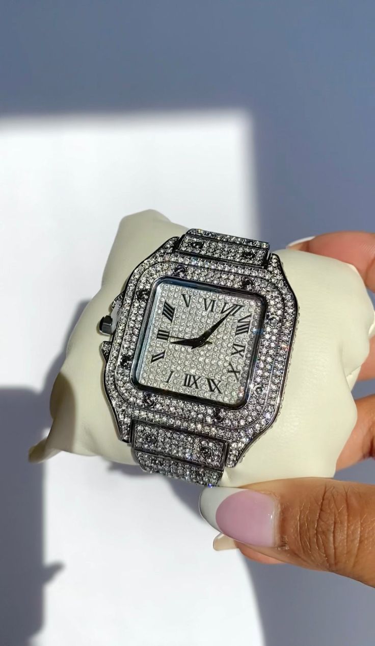 The name says it all. The Billionaire Water is encrusted with stones everywhere so it sparkles like crazy! This watch will elevate any outfit giving you total Boss Babe vibes. Pair it with a bracelet or wear it alone. The links on the watch are removeable so you can get your perfect fit. This watch is shipped with a watch box and watch pillow for storing.Material: Stainless steelDial diameter: 40.6mmSize: Adjustable Hypoallergenic Tarnish Free Glazd Pouch with every order Free US Shipping Easy E Diamond Bling Watch As Gift, Luxury Diamond Watch With Rhinestones For Parties, Silver Diamond Watch With Cubic Zirconia For Parties, Luxury Silver Watch For Parties, Luxury Stainless Steel Jewelry With Rhinestones, Luxury Diamond Watch With Metal Dial As Gift, Silver Diamond Watch With Bling For Party, Luxury Bling Diamond Watch For Party, Diamond Watch With Bling As A Gift