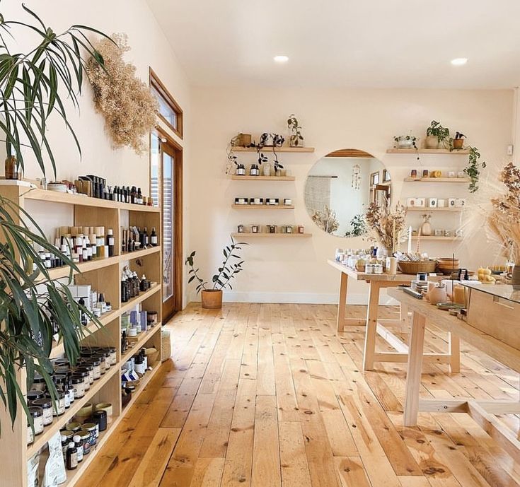 a room with wooden floors and shelves filled with items