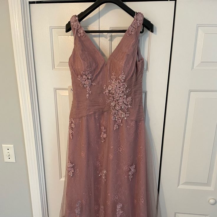 Brand New With Tags. Purchased For A Wedding But Never Worn. Color Is Desert Rose. Comes With Matching Shawl. Smoke Free Pet Free Home. Elegant Tulle Maxi Dress For Wedding, Elegant Lace Bridesmaid Dress With Sweep Train, Pink Sleeveless Mother Of The Bride Dress For Wedding, Sleeveless Pink Mother Of The Bride Dress For Wedding, V-neck Mother Of The Bride Dress With Fitted Bodice, Mother Of The Bride Floor-length Dress With Sweep Train, Lace Bridesmaid Gown Floor-length, Lace Floor-length Bridesmaid Gown, Floor-length Lace Bridesmaid Gown