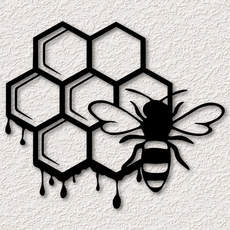 a black and white drawing of a bee next to honeycombs with dripping drops