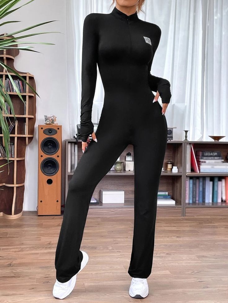 You will surely look stunning in this black-colored Letter Patched Flare Leg Jumpsuit. The sleek black fabric is adorned with a bold letter pattern and patched details that make it stand out from the crowd. The regular fit provides comfortable wear, while the stand collar and full-length zipper give it a modern touch. Specifications: Color: Black Style: Casual Pattern Type: Letter Details: Patched, Zipper Length: Long Fit Type: Regular Fit Neckline: Stand Collar Sleeve Length: Long Sleeve Sleeve Flare Leg Jumpsuit, Comfy Jumpsuits, Clean Body, Style Noir, A Letter, Natural Fabrics, Shoulder Sleeve, Black Fabric, Stand Collar