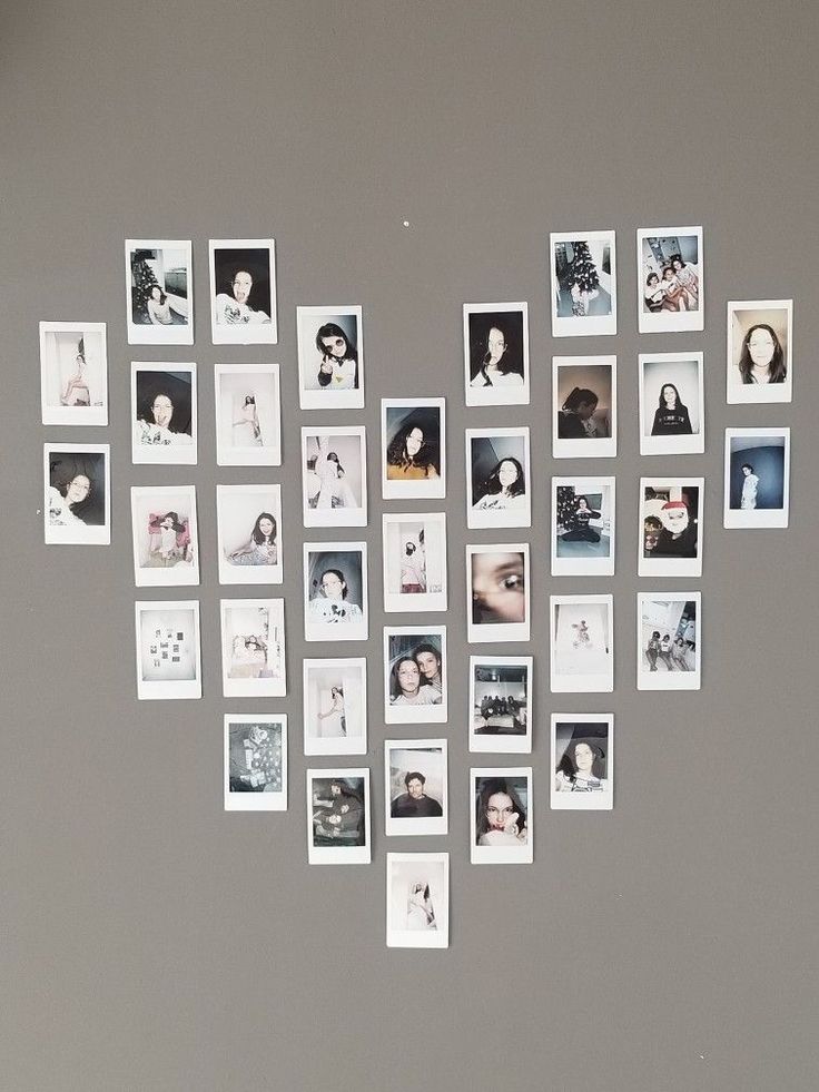 a refrigerator covered in pictures and magnets on top of it's side wall